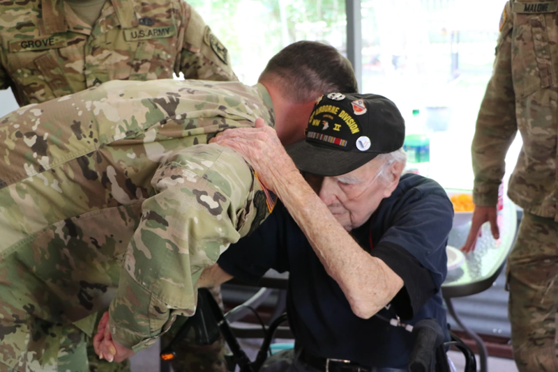 A Vietnam veteran with a U.S. Army soldier